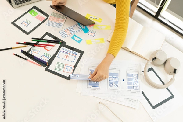 Obraz Creative web designer planning UI application and developing digital template