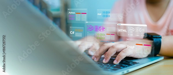 Obraz Software Developer working on laptop with virtual coding language screens