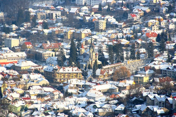Fototapeta View of the winter city of Brasov, Romania from the neighboring mountain