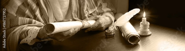 Obraz Man holding an old scroll