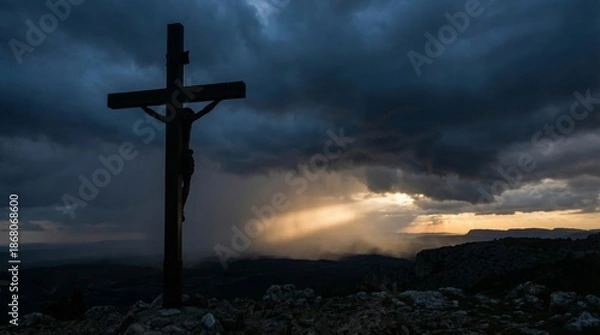 Obraz Dramatic sunset with crucifix silhouette against stormy sky for easter reflection concept