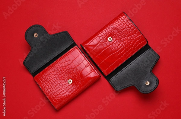Obraz Red crocodile leather wallets on red background.