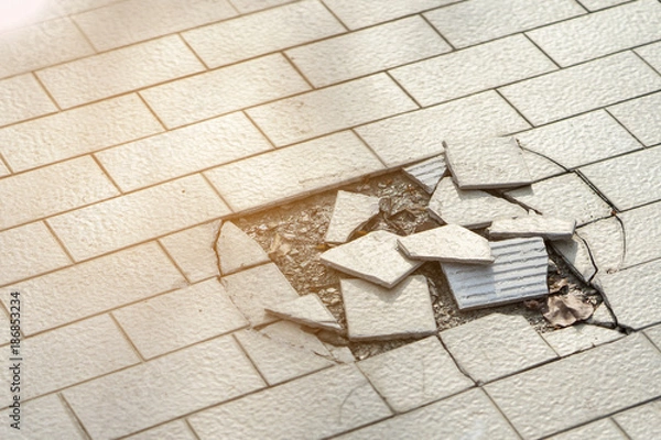 Obraz Cracked and broken tiles floor .