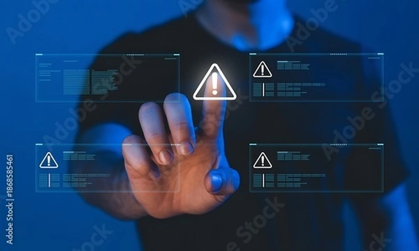 Obraz Man interacting with futuristic digital interface displaying warning notifications