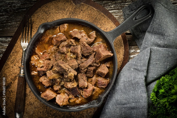 Obraz Beef stew in a cast iron skillet.