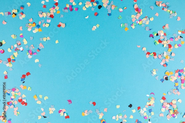 Fototapeta blue background frame with confetti