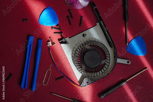 Obraz Computer Cooling Fan and Tools on Red.