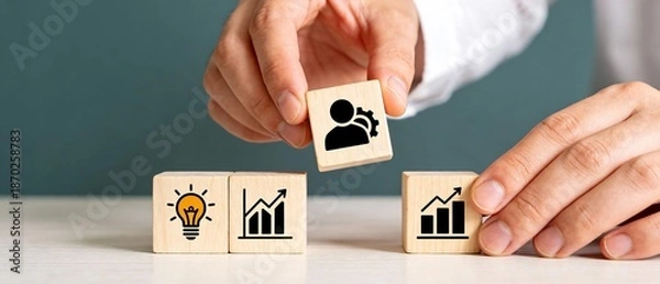 Obraz 手元でアイコンキューブを配置する革新性を示すミニマル構図