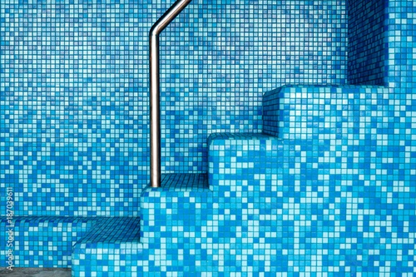 Fototapeta The steps in the pool with blue tiles