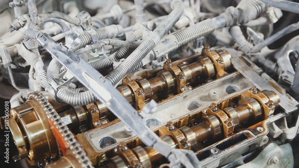 Fototapeta The internal combustion engine, disassembled, repair at car service, overhaul, under the hood of the car