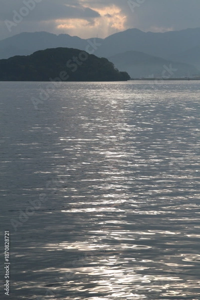 Obraz 夕日の光が反射する海面