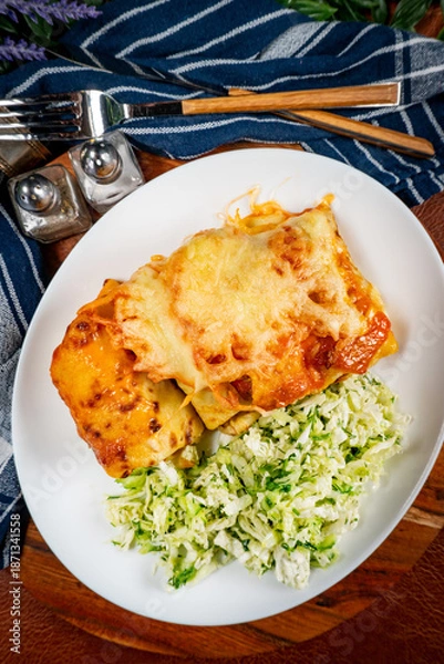 Obraz Stuffed pancake baked with cheese.