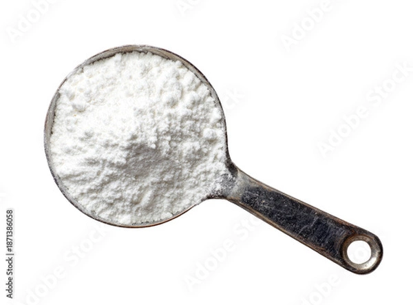 Obraz Measuring cup filled with white flour