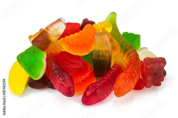 Fototapeta The colored fruit jelly sweets on white background