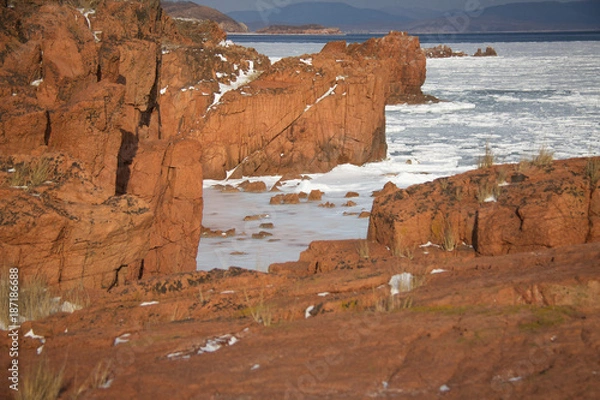 Obraz Red rocks in ice captivity.