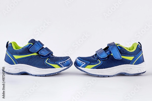 Fototapeta Sport running shoes on white background. Pair of sport trainers isolated on white background. Sport and healthy lifestyle concept.