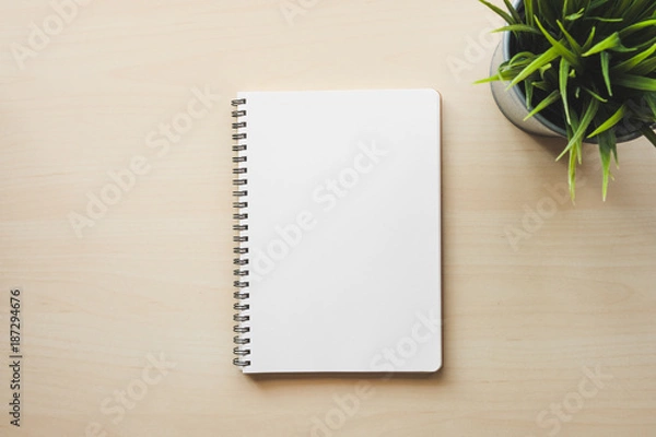 Fototapeta Empty white notebook top view on wooden table
