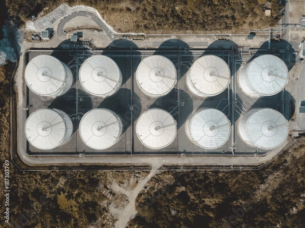 Fototapeta drone view of storage tank in the forest