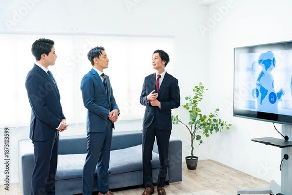 Fototapeta 打ち合わせをする3人の男性