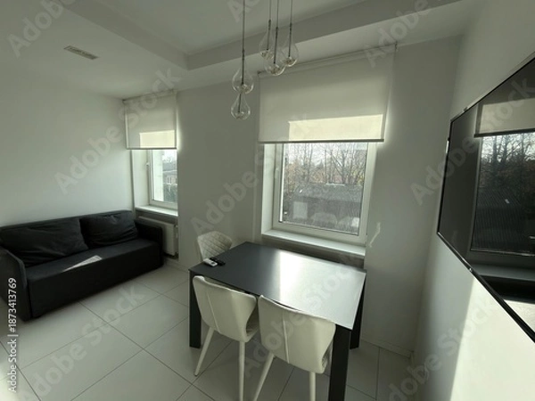 Obraz Modern bright dining area with sofa and large windows