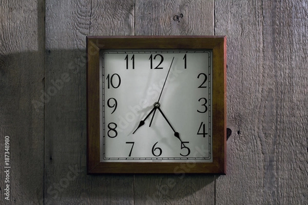 Fototapeta the clock hangs on a wooden wall