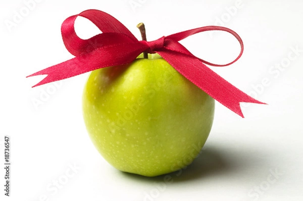 Obraz Green apple and red ribbon bow