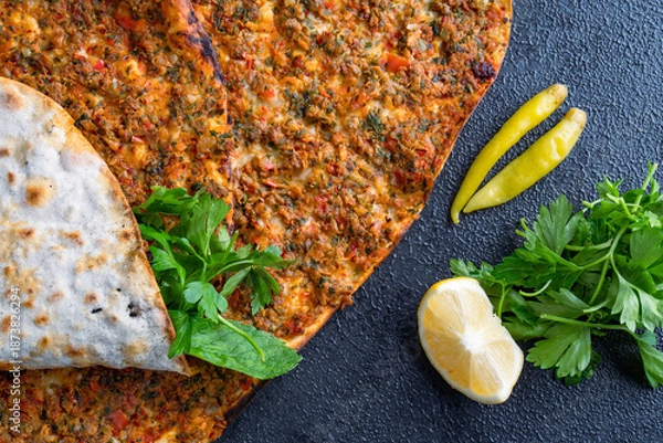 Obraz Big size lahmacun on black stone background