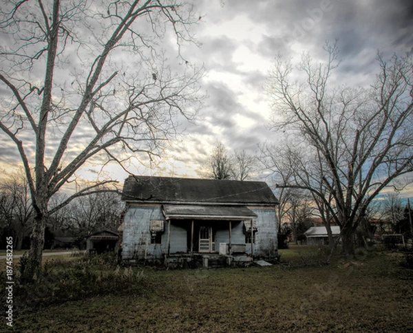 Obraz Run down shack with stormy sky