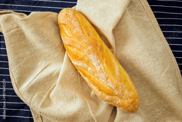 Obraz Freshly baked bread on a kitchen cloth