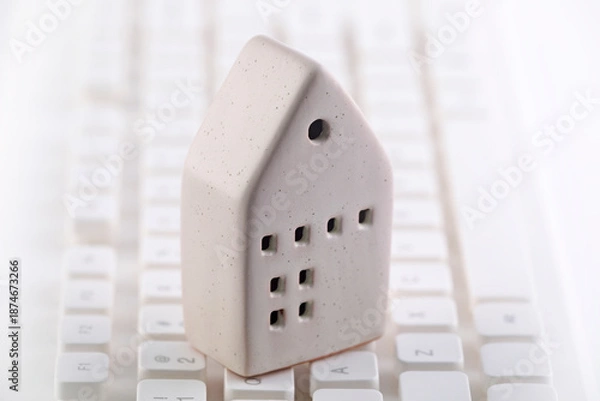 Obraz Small house on white computer keyboard