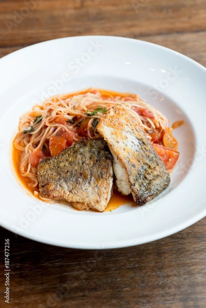 Obraz Grilled sea bass and spaghetti with tomato sauce