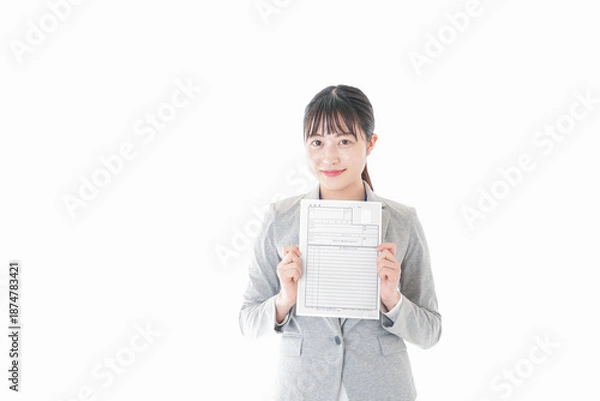 Obraz 履歴書を持つビジネスウーマン