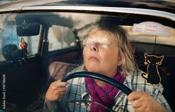 Obraz Senior woman in oldtimer car