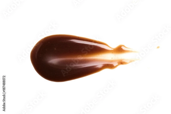 Fototapeta Chocolate caramel sauce stripe on a plain white backround