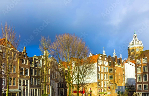 Fototapeta The ald building at Amsterdam city during sunset.