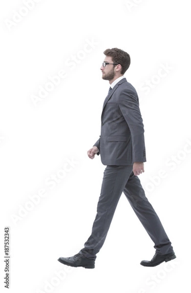 Fototapeta side view confident businessman goes forward.