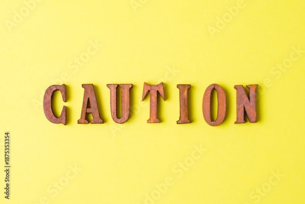 Obraz 黄色い背景とCAUTIONの文字イメージ
