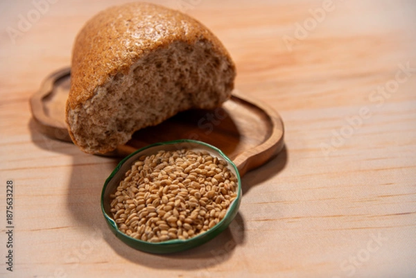 Obraz Wheat and brown bread on a tray