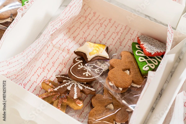 Obraz Open Holiday Cookie Gift Boxes with Festive Assorted Treats