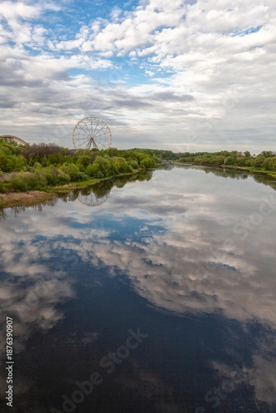 Obraz Ferris wheel and river landscape with sky reflection