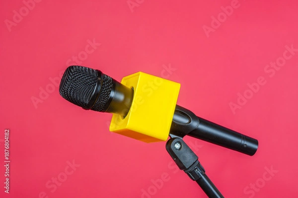 Obraz Wireless microphone with stand on a red background