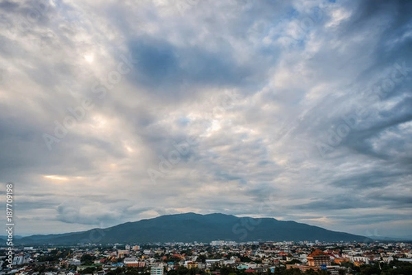 Fototapeta Cityscape at evening with clouds skyline twilight and sunset