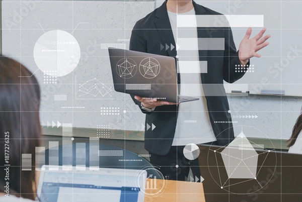 Obraz ノートパソコンを持ちプレゼンテーションを行うビジネスパーソン