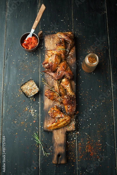 Obraz Grilled chicken wings with spices and rosemary
