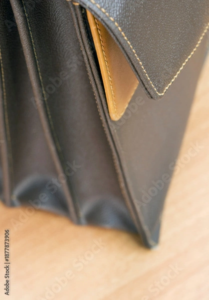 Fototapeta selective focus on brown leather briefcase on table