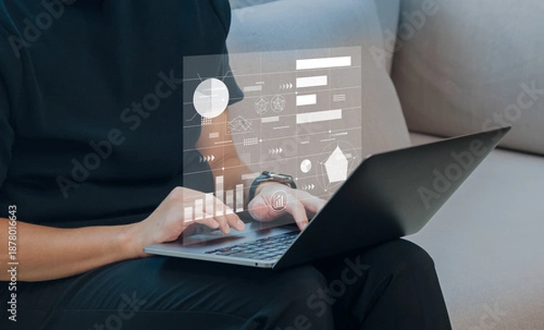 Obraz ノートパソコンでデータ解析を行うビジネスマン　マーケティング戦略立案や企業の成長に向けた統計データの分析イメージ　