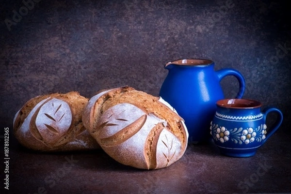 Fototapeta Background with two breads from wheat flour	