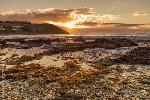Obraz Colourful sunset at the beach with pebbles in Myponga Beach South Australia