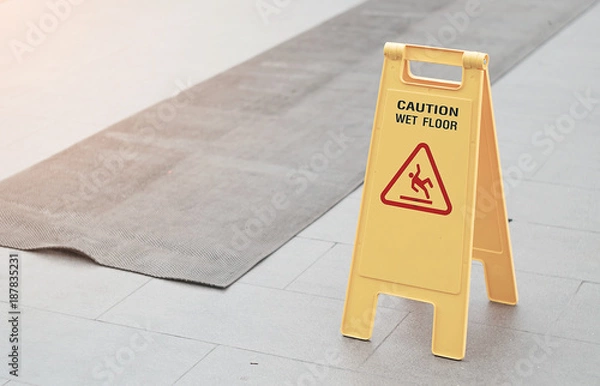 Fototapeta Caution wet floor place on the floor after raining.