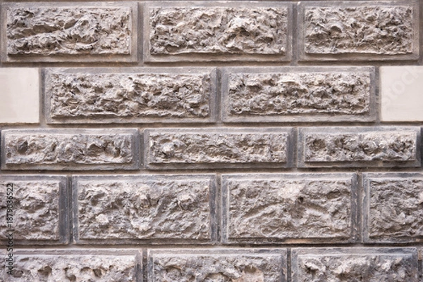 Fototapeta Structured stone brick wall with rectangular masonry pattern
